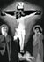 Black and white painting of Jesus on the Cross with his mother at his feet.